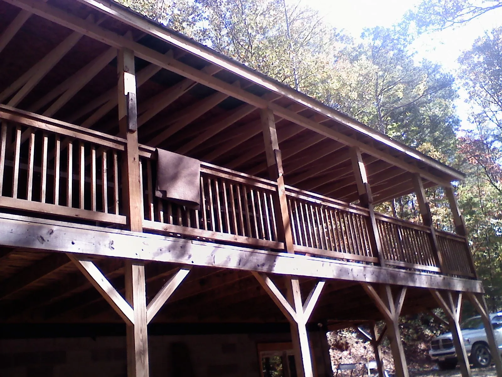 Timber framing under a new elevated porch and deck — Roof Leak Repair in West Monroe by Roofing Brothers